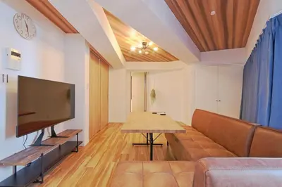 a living room with a couch and a flat screen tv at V Close to Kyodo sta 12 min to Shinjuku in Tokyo