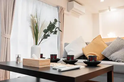 a living room with a coffee table and a couch at SAIEI Hotel in Tokyo