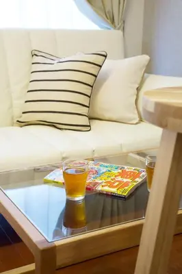 a coffee table with a glass of beer on it at BAi\u6b4c\u821e\u4f0e\u753a2\u4e01\u76ee in Tokyo