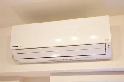 a white dvd player hanging from a ceiling at BAi\u6b4c\u821e\u4f0e\u753a2\u4e01\u76ee in Tokyo