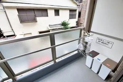 a balcony with a view of a building at BAi\u6b4c\u821e\u4f0e\u753a2\u4e01\u76ee in Tokyo