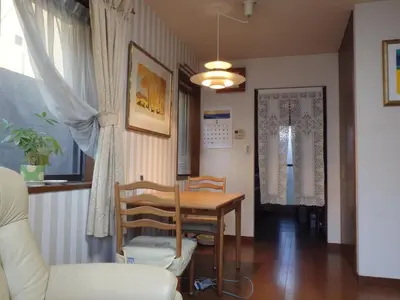 a dining room with a table and chairs at GP House in Tokyo