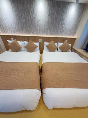 two beds sitting next to each other in a room at SUN House asakusabashi akihabara tokyo in Tokyo