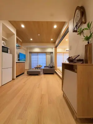 a large room with a kitchen and a living room at SUN House asakusabashi akihabara tokyo in Tokyo