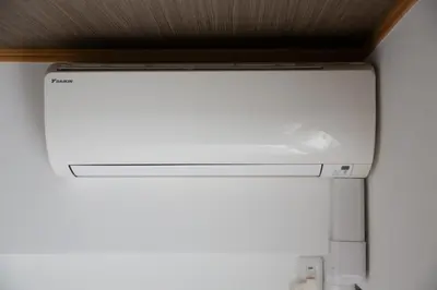 a white refrigerator freezer sitting in a room at NIYS apartments 56type in Tokyo