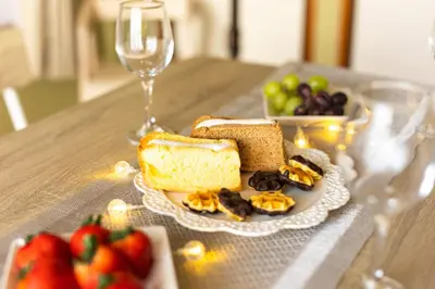 a plate of bread and fruit and a glass of wine at Kichi01 \u5927\u4eba\u3082\u5b50\u4f9b\u3082\u3086\u3063\u304f\u308a\u3068\u3067\u304d\u308b\u304a\u90e8\u5c4b in Tokyo