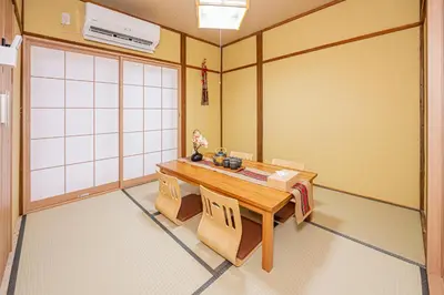 a dining room with a table and chairs at skytree Family Hotel in Tokyo