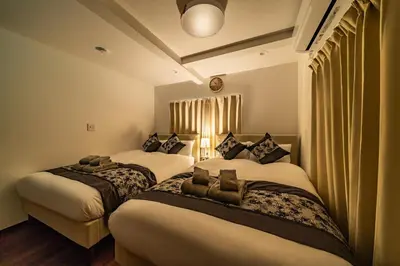 a hotel room with two beds in a room at Kokoon Hotel Shibamata in Tokyo
