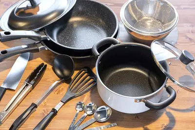 a table with utensils and pans and spoons at Sumu Hotel Shinjuku in Tokyo