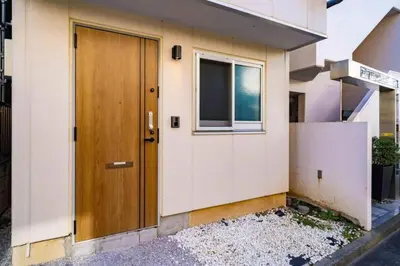 a door of a house with a window at Kokoon Hotel Kitashinjuku in Tokyo