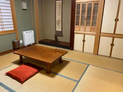 a room with a table and a room with a door at S & K Garden House in Tokyo