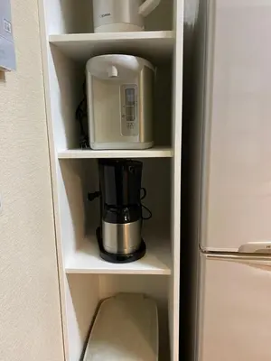 a coffee maker and a blender inside of a refrigerator at S & K Garden House in Tokyo