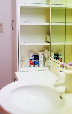 a bathroom with a sink and a mirror at \u70df\u96e8\u8f69 203 in Tokyo