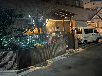 a white van parked in front of a house with lights at \u70df\u96e8\u8f69 303 in Tokyo