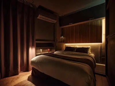 a bedroom with a large bed with a window at Tokyo Skyline Hideaway in Tokyo