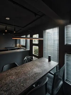a dining room with a table and chairs and windows at Tokyo Skyline Hideaway in Tokyo