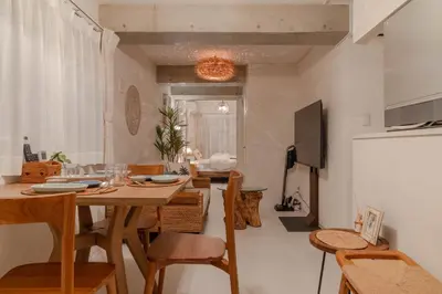 a kitchen and dining room with a table and chairs at Cloud Nine Apartment Sky Tree in Tokyo