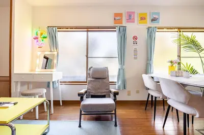 a waiting room with chairs and a table at Ohanachaya 3 Chome in Tokyo