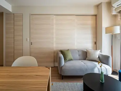 a living room with a couch and a table at Section L Residence Shibuya in Tokyo
