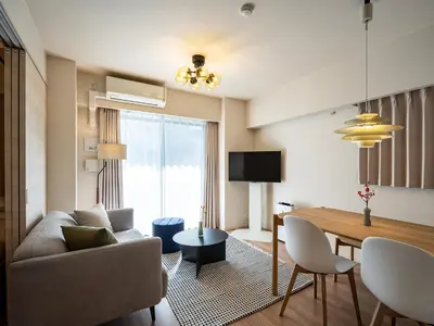 a living room with a couch and a table at Section L Residence Shibuya in Tokyo