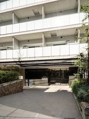 an external view of a building with a courtyard at Section L Residence Shibuya in Tokyo