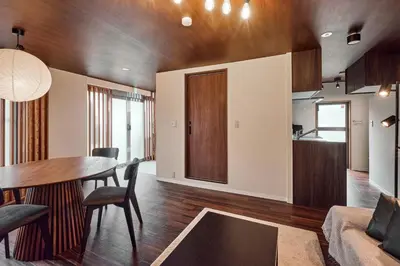 a dining room and living room with a table and chairs at asanagi in Tokyo