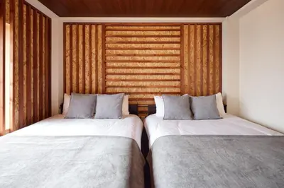 two beds sitting next to each other in a room at asanagi in Tokyo