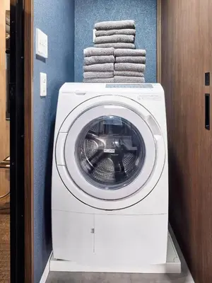 a washing machine with towels on top of it at asanagi in Tokyo