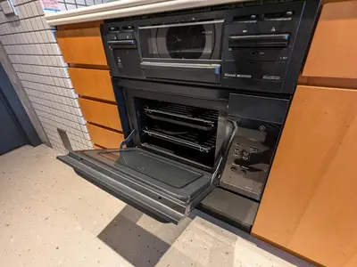 an oven with its door open in a kitchen at Family and Group stay, Private house close to Shinjuku in Tokyo