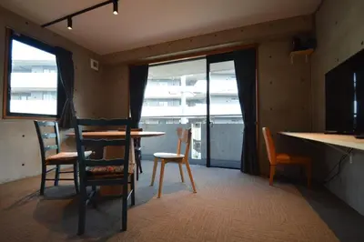 a room with a table and chairs and a counter at Family and Group stay, Private house close to Shinjuku in Tokyo