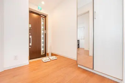a pair of shoes in a room with a mirror at New house Solamachi Tokyo 5 min walk, Asakusa 2 min away, direct airport access, great for families and groups in Tokyo