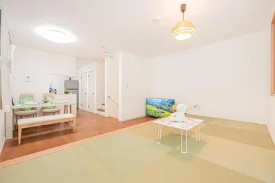 a living room with a table and a dining room at New house Solamachi Tokyo 5 min walk, Asakusa 2 min away, direct airport access, great for families and groups in Tokyo