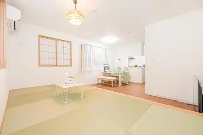 a living room with a table and a dining room at New house Solamachi Tokyo 5 min walk, Asakusa 2 min away, direct airport access, great for families and groups in Tokyo