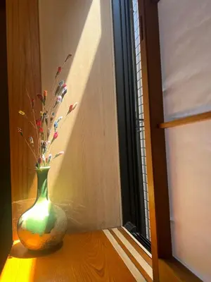 a vase sitting on a table next to a window at TSURUNOYA The only private lodging in Tokyo Japanese Tatami style 8 minutes walk from station free Parking new open Asakusa Akihabara Tokyo sky tree Disneyland nearby 110m2 in Tokyo