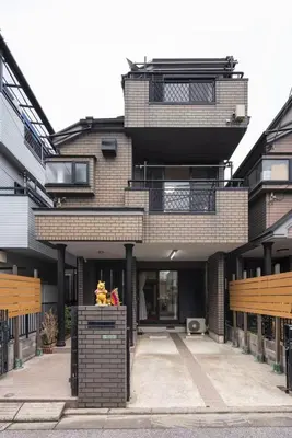 a large brick building with a balcony on top of it at TSURUNOYA The only private lodging in Tokyo Japanese Tatami style 8 minutes walk from station free Parking new open Asakusa Akihabara Tokyo sky tree Disneyland nearby 110m2 in Tokyo