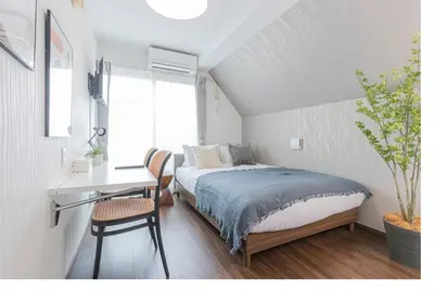 a bedroom with a bed and a desk and a window at \u3077\u3075\u304bTk\u6771\u5411\u5cf6301-1min to Higashi Mukojima Sta 3F Cozy Stay Near Skytree Asakusa in Tokyo