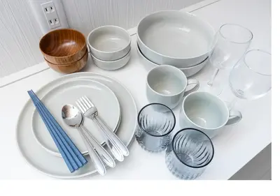 a group of plates and cups and utensils on a counter at \u3077\u3075\u304bTk\u6771\u5411\u5cf6301-1min to Higashi Mukojima Sta 3F Cozy Stay Near Skytree Asakusa in Tokyo