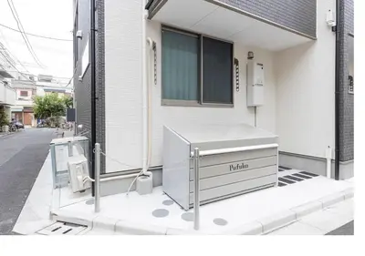 a white dresser sitting outside of a house at \u3077\u3075\u304bTk\u6771\u5411\u5cf6302-1min to Higashi Mukojima Sta 3F Cozy Stay Near Skytree Asakusa in Tokyo