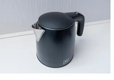 a black pot is sitting on a shelf at \u3077\u3075\u304bTk\u6771\u5411\u5cf6303-1min to Higashi Mukojima Sta 3F Cozy Stay Near Skytree Asakusa in Tokyo