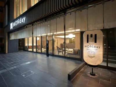 a lobby of a building with a monopoly sign in front at Premium Apart MONday GINZA EAST in Tokyo