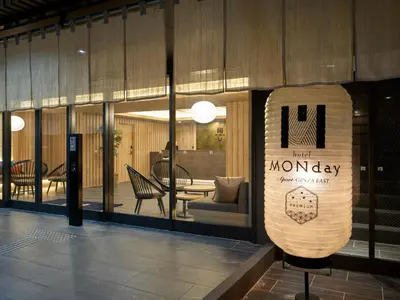 a store front with a sign that readsmt monopoly at Premium Apart MONday GINZA EAST in Tokyo