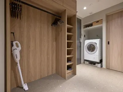 a laundry room with a washing machine and a washer and dryer at Premium Apart MONday GINZA EAST in Tokyo