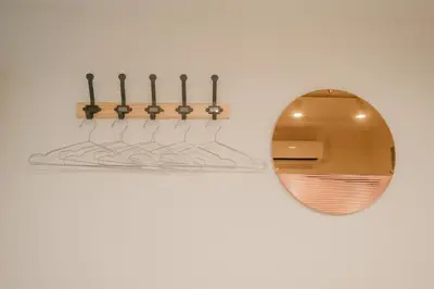 a metal holder with a row of matches on a wall at Mi-HOTEL KAGURAZAKA in Tokyo