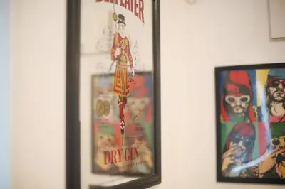 two framed movie posters on a wall at HAMA HILLS Shinjuku House in Tokyo