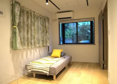 a bed in a room with a window at Koenji Nakano VILLA - Vacation STAY 00734v in Tokyo