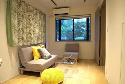a living room with a couch and a window at Koenji Nakano VILLA - Vacation STAY 00734v in Tokyo