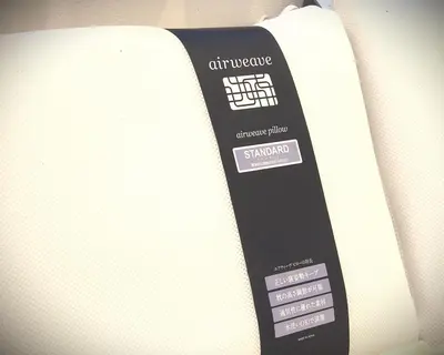 a remote control sitting on the side of a mattress at Koenji Nakano VILLA - Vacation STAY 00734v in Tokyo