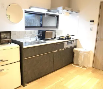 a kitchen with a sink and a microwave at Koenji Nakano VILLA - Vacation STAY 00734v in Tokyo