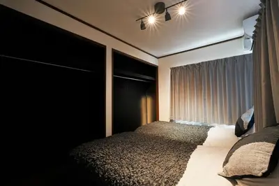 a bedroom with a bed and a window at Zen Sleep Tokyo Ikegami in Tokyo