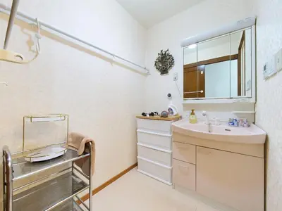 a bathroom with a sink and a mirror at Koka House TOKYO ASAKUSA in Tokyo